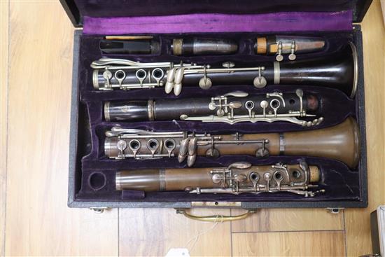 Four cased clarinets - two by Buffet and two by Boosey & Hawker